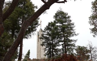 View of the Hallelujah bell tower through a disassembled Wayfarers Chapel